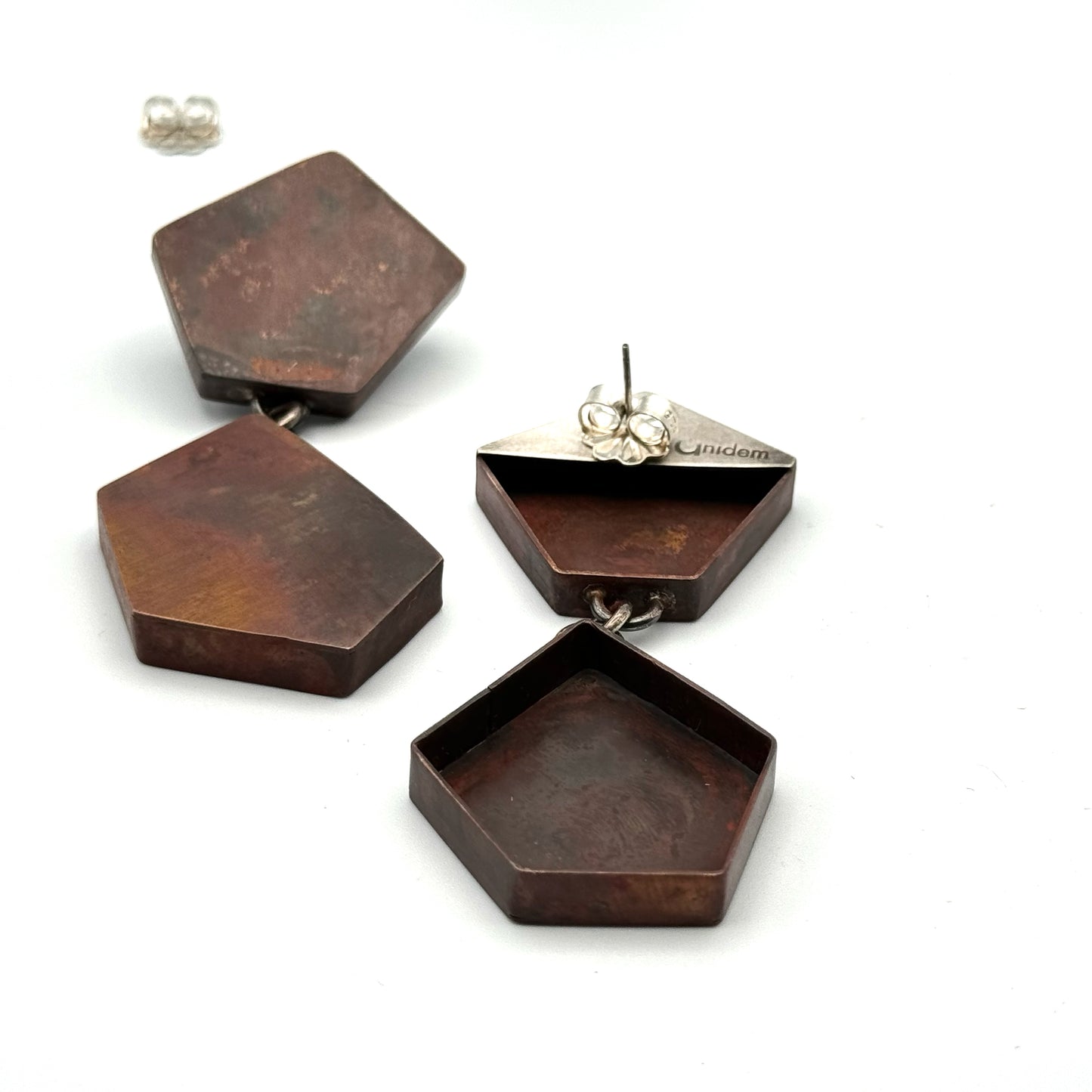 Hollow construction copper earrings