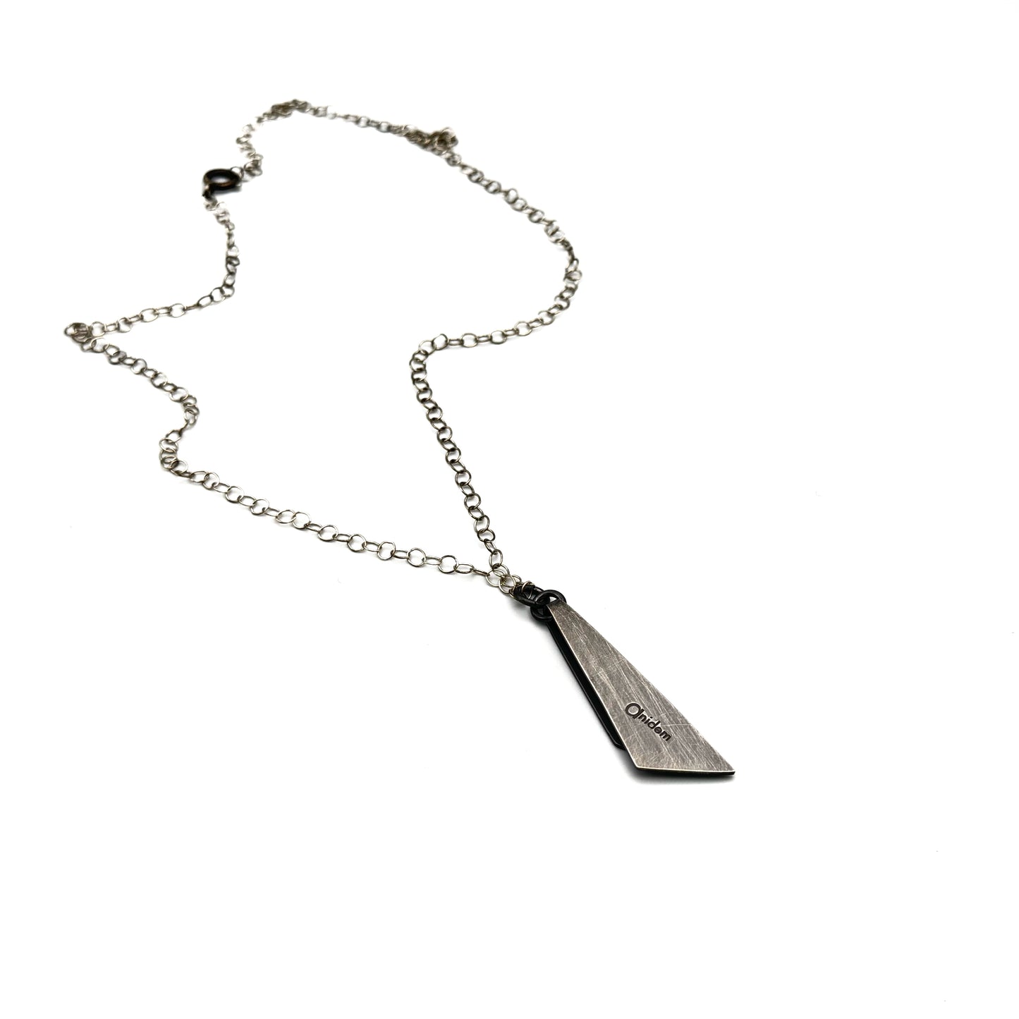 Hand pierce oxidize, silver pendant.