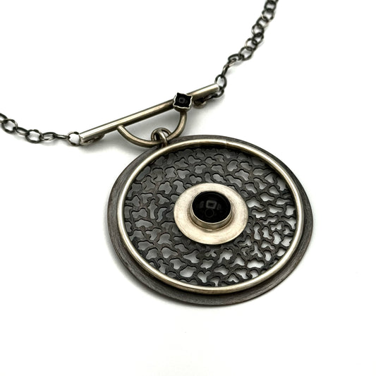 Silver and copper hand pierced pendant/necklace with Onyx